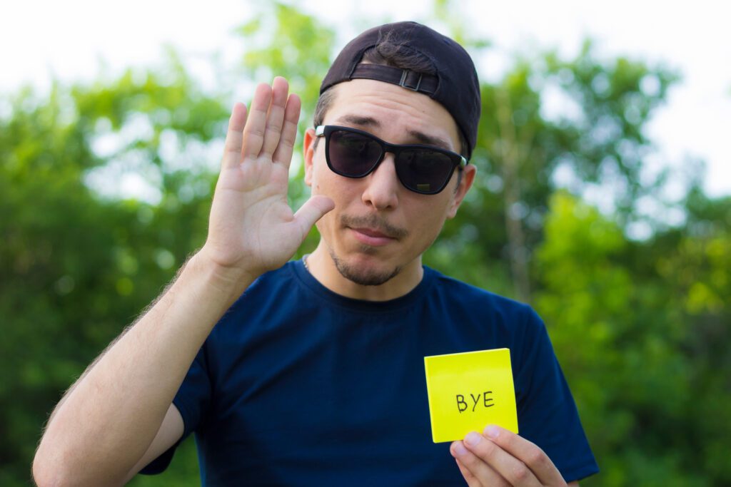 man waving good bye to trouble